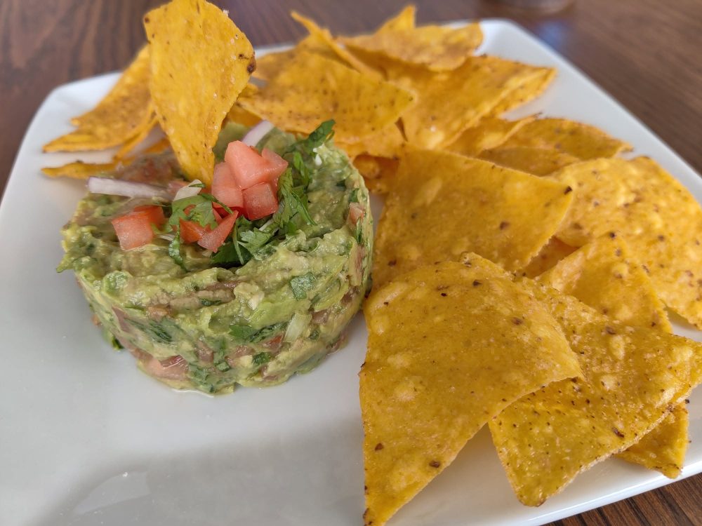Fresh guacamole with pico de gallo and tortilla chips